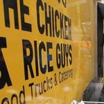 Boston, MA 121714 (ltor) Fiksu employees Max Weinstein (cq) and Phil Wu (cq) are regulars at the Chicken and Rice Guys food truck at Copley Square, Wednesday, December 17 2014. (Wendy Maeda/Globe Staff) section: Business slug: xxBusinessLunch-Johnston01 reporter: Katie Johnston